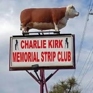 Sign with a big cow on top saying: "Charlie Kirk memorial strip club"