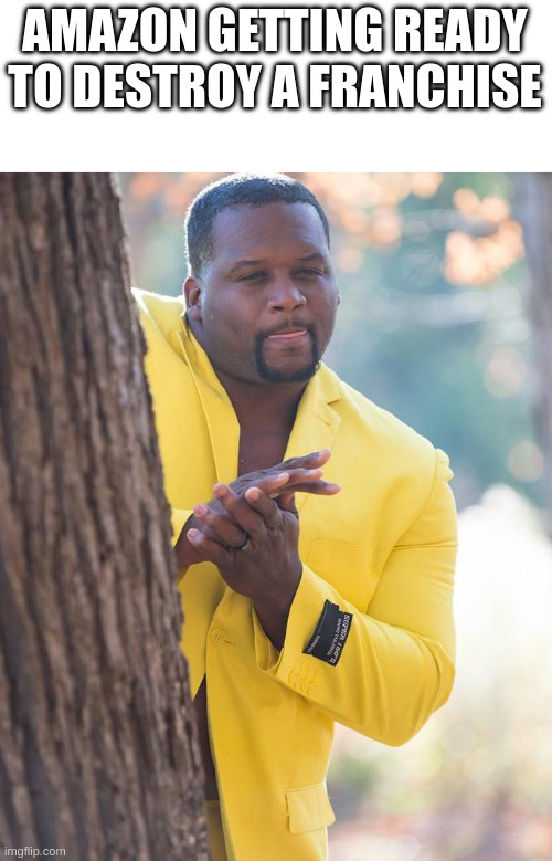 Anthony Adams rubbing hands while peaking out behind a tree with text above his head "Amazon getting ready to destroy a franchise"