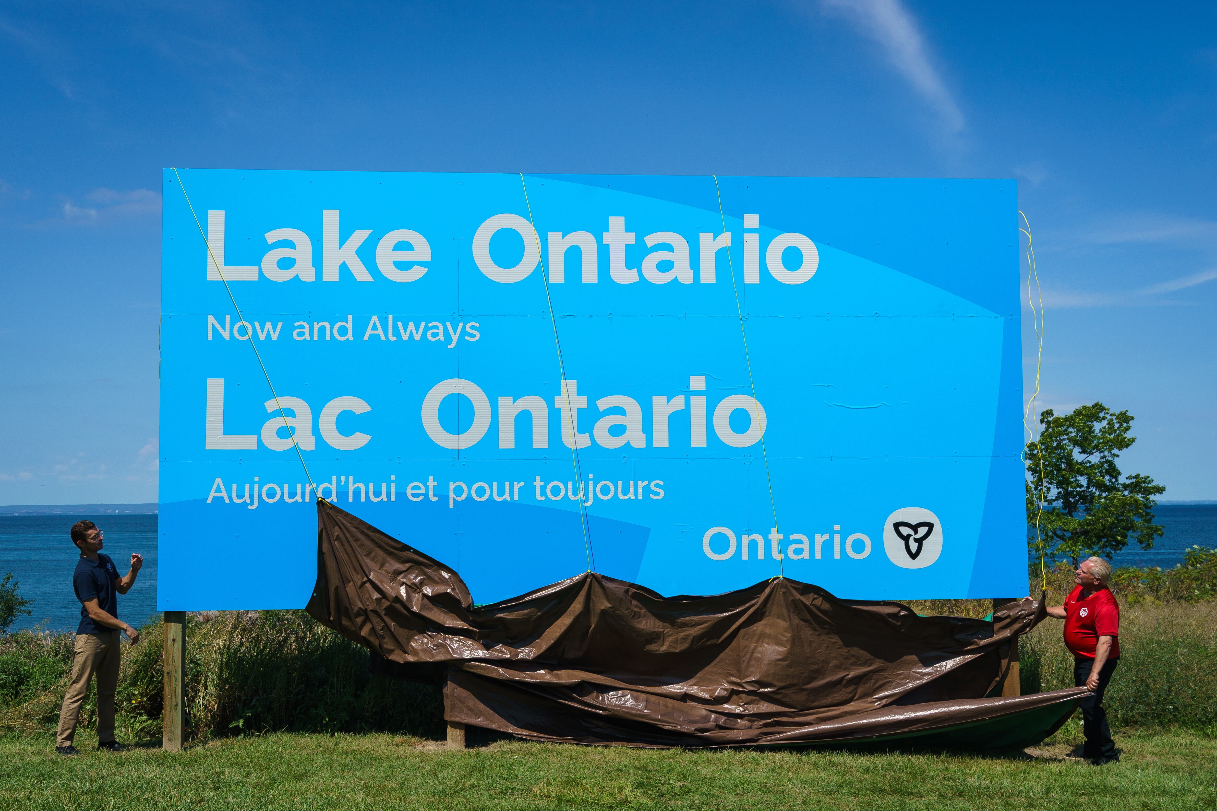 Ontario Premier Doug Ford unveiled a billboard on the Canadian shoreline, with the message "Lake Ontario — Now and Always," The sign, written in English and French, was put up near the U.S. border