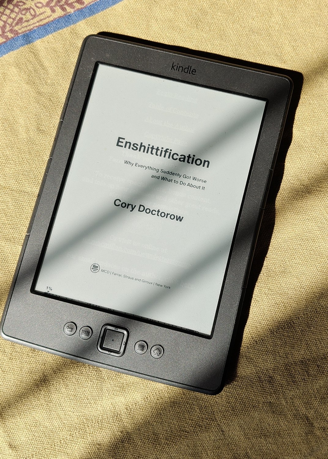  A kindle showing Enshittification book. 