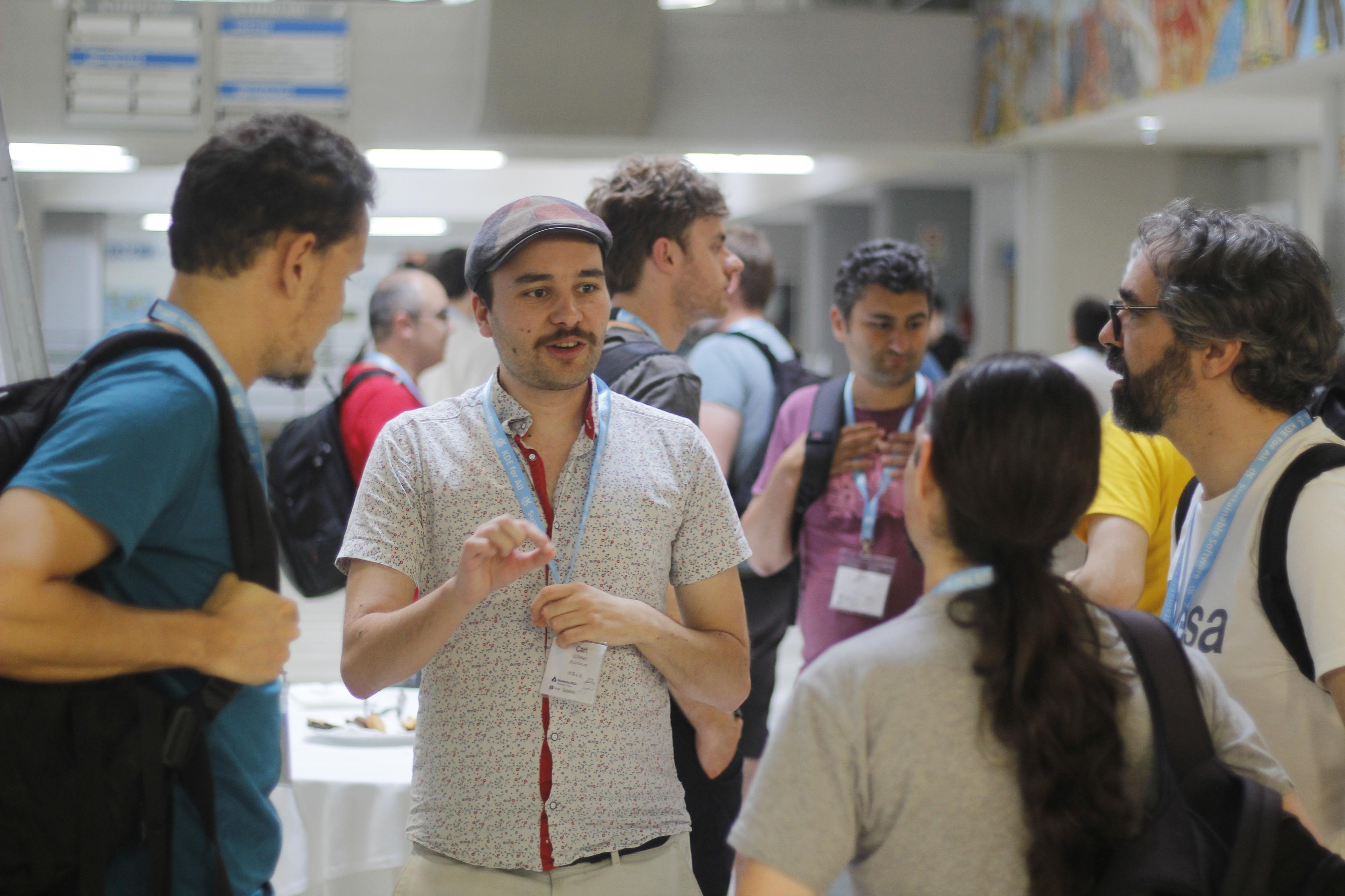 Picture of the KDE community members talking to each other during Akademy 2023.